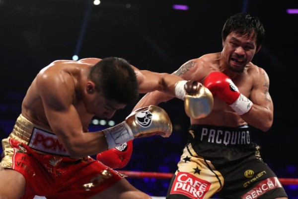 LAS VEGAS, NV - NOVEMBER 05:   (R-L) Manny Pacquiao of the Philippines and Jessie Vargas trade punches during their WBO welterweight championship fight at the Thomas & Mack Center on November 5, 2016 in Las Vegas, Nevada. (Photo by Christian Petersen/Getty Images)