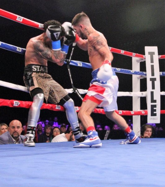 Nico Hernandez Shows Medal in pro Debut