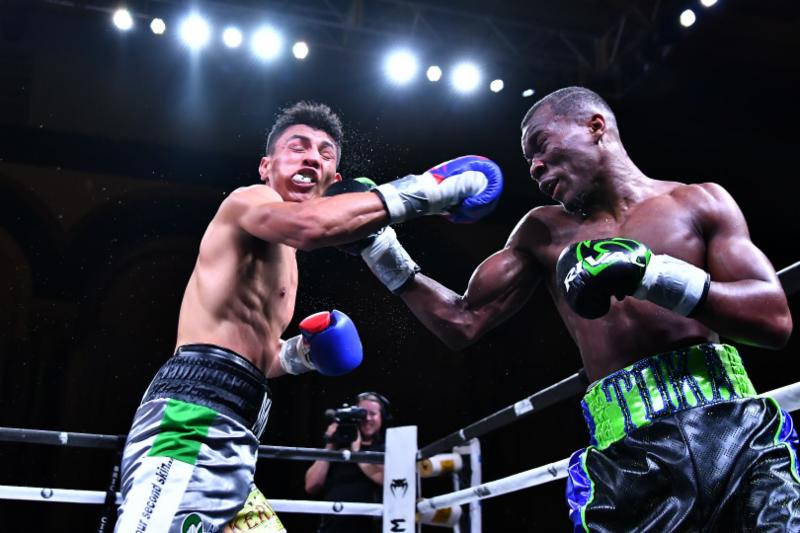Toka Kahn Clary Retains NABA Featherweight Title